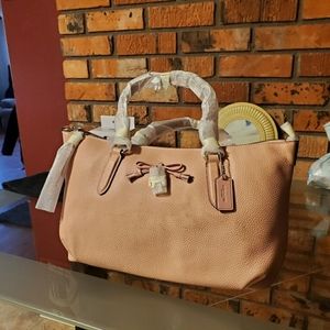 Brand new Coach purse. Tags still on.